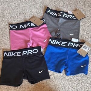 Nike Kids' Pro Shorts - Vibrant Pink, Classic Gray, Bold Black, Bright Blue